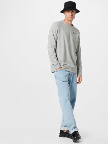 NIKE - Sweatshirt de desporto em cinzento