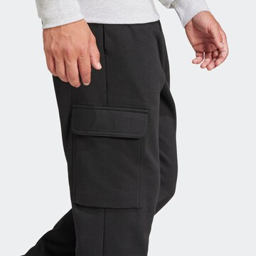 ADIDAS SPORTSWEAR Конический (Tapered) Спортивные штаны 'Essentials' в Черный