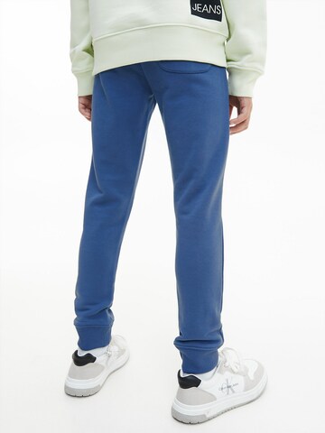Calvin Klein Jeans Tapered Broek in Blauw