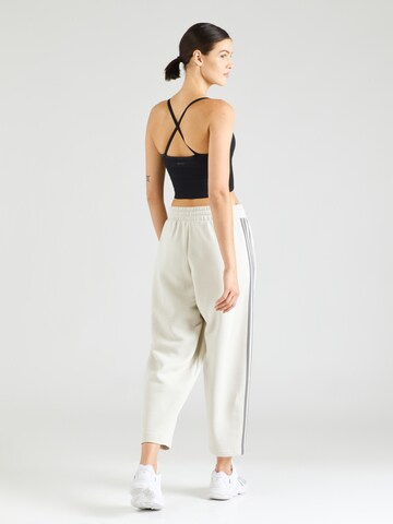 ADIDAS SPORTSWEAR Lużny krój Spodnie sportowe 'Essentials' w kolorze beżowy