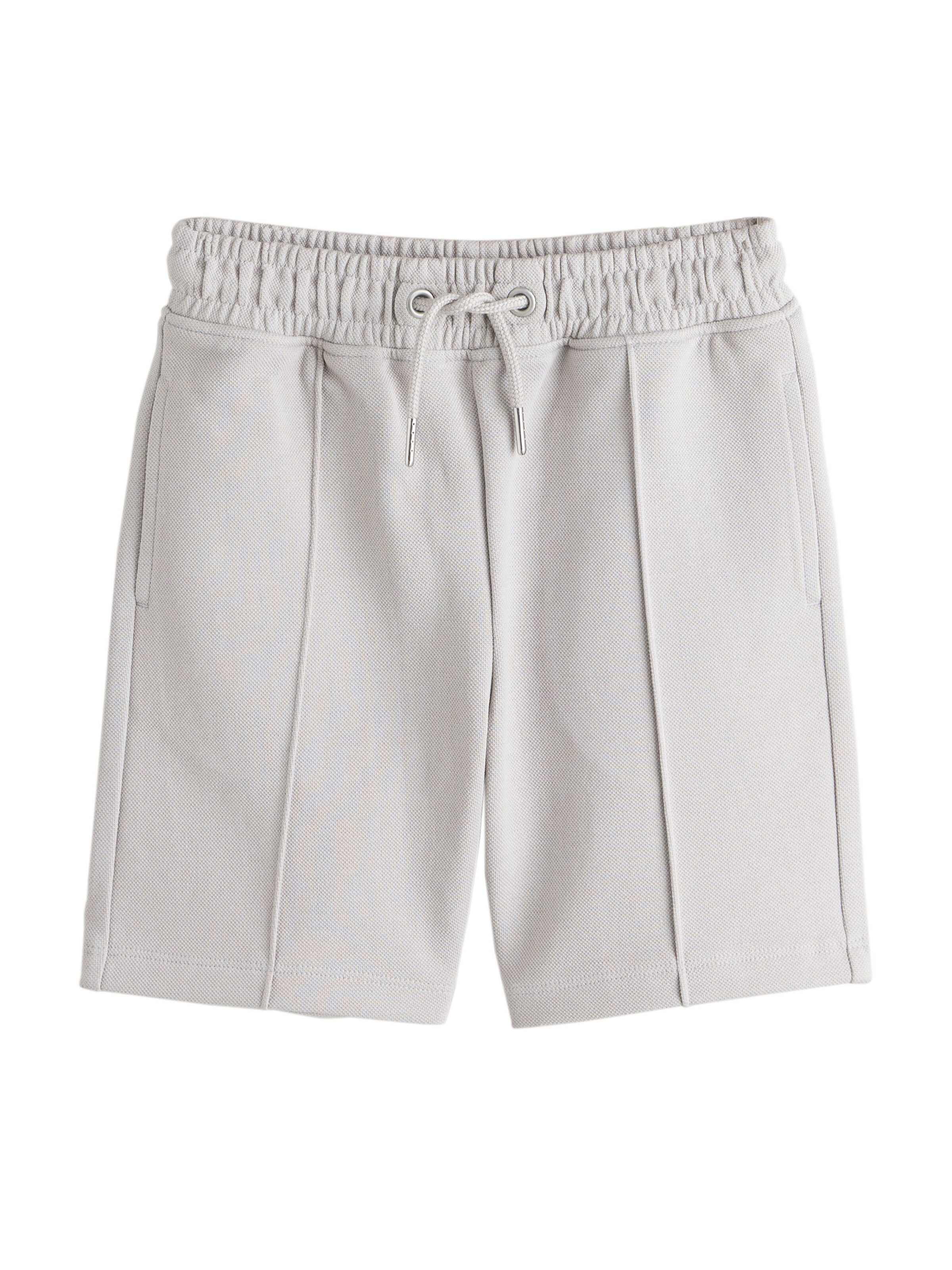 Next Nohavice - Sivá: predná strana