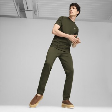 PUMA Tapered Sporthose 'Evostripe' in Grün
