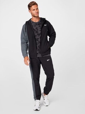 Reebok Sports Suit in Black: front