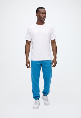 UNDER ARMOUR - Tapered Pantalón deportivo en azul