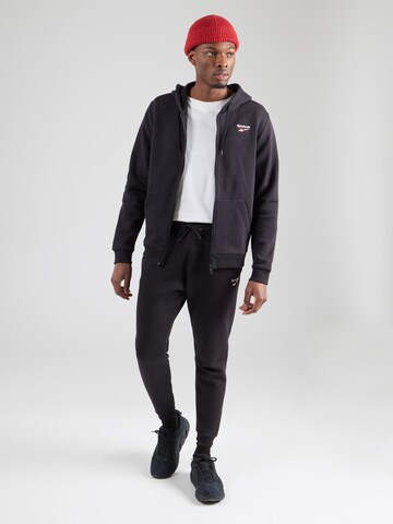 Reebok - Sudadera con cremallera deportiva en negro
