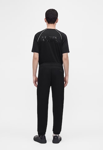 EA7 Emporio Armani Tapered Sportbyxa 'NATURAL VENTUS7' i svart