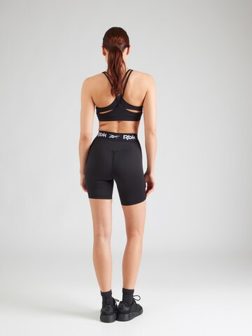 Reebok Skinny Sportnadrágok 'ID TRAIN' - fekete