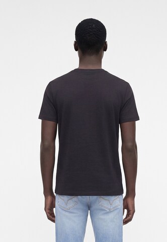 Maglietta di GUESS in nero: dietro