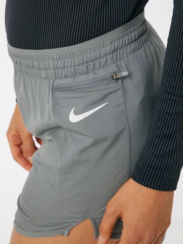 NIKE Regular Workout Pants in Grey