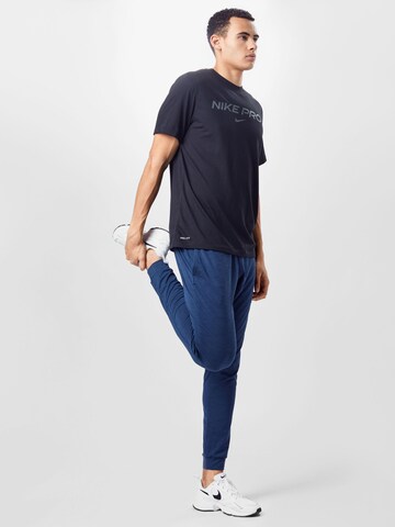 NIKE Tapered Sporthose in Blau