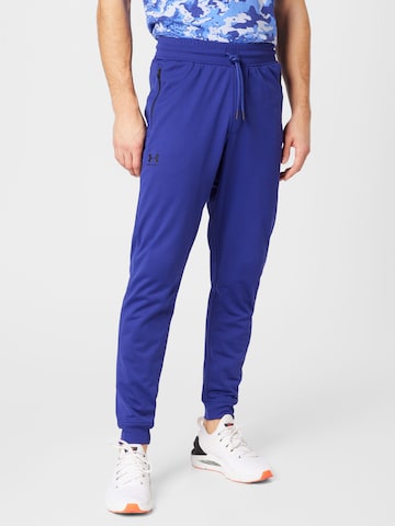 UNDER ARMOUR - Tapered Calças de desporto em azul: frente