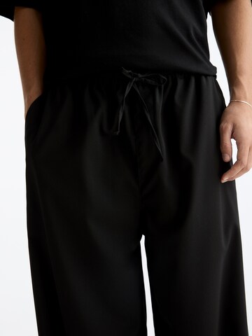 Wide leg Pantaloni di Pull&Bear in nero