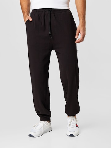 Tommy Jeans Tapered Pants in Black: front