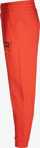 Tapered Pantaloni sportivi 'CR7 Club Fleece' di NIKE in rosso
