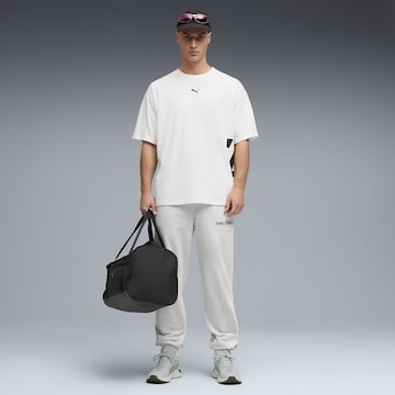 Effilé Pantalon de sport PUMA en gris