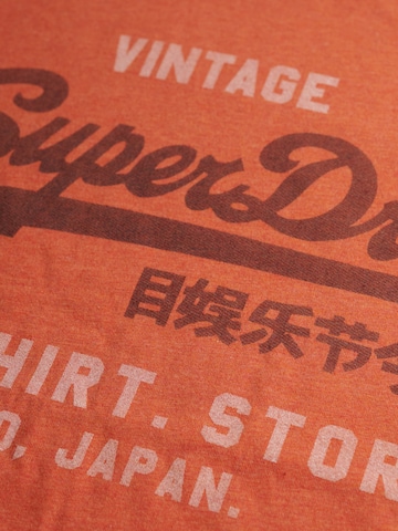 Superdry & Co Póló 'Heritage' - narancs