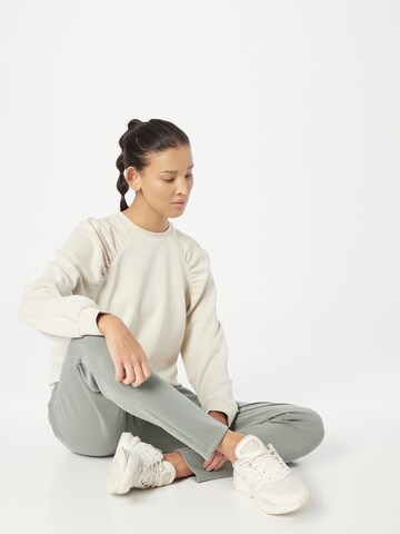 Athlecia Sports sweatshirt in Beige