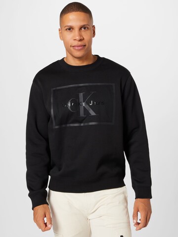 Calvin Klein Jeans - Sweatshirt em preto: frente