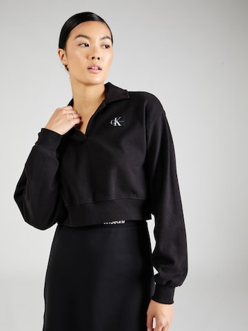 Sweat-shirt Calvin Klein Jeans en noir : devant