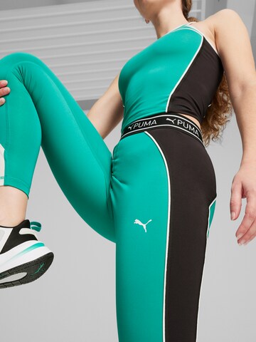 Skinny Pantaloni sport de la PUMA pe verde