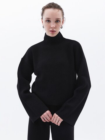 Pull-over OXXO en noir : devant