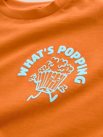 T-Shirt Next en orange