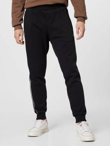 ADIDAS ORIGINALS Tapered Trousers 'Adicolor Seasonal Archive' in Black: front