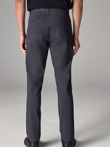 Skinny Pantaloni chino di Next in nero