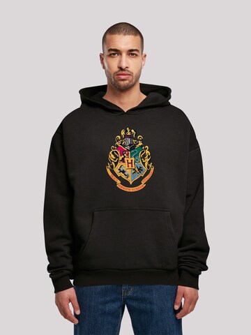 Felpa 'Harry Potter Hogwarts Crest Gold' di F4NT4STIC in nero: frontale