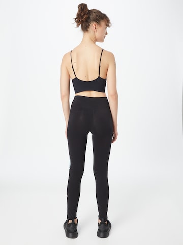 Skinny Pantaloni sportivi di Champion Authentic Athletic Apparel in nero