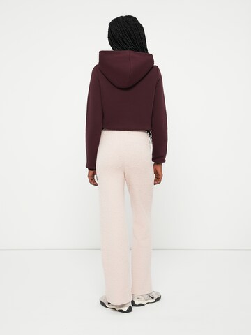 Nike Sportswear Szabványos Nadrág 'Phoenix' - rózsaszín