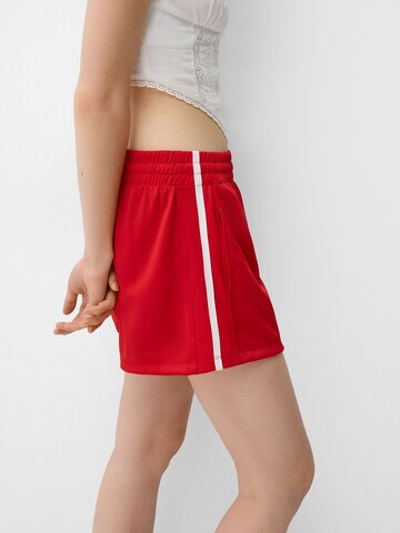 Bershka Szabványos Nadrág - piros