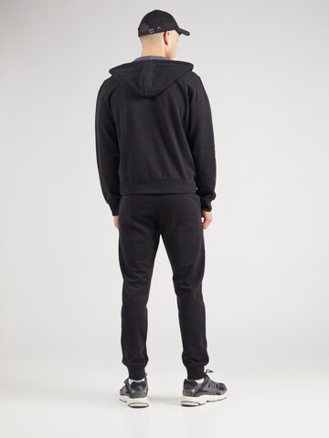 Tuta da jogging di Champion Authentic Athletic Apparel in nero