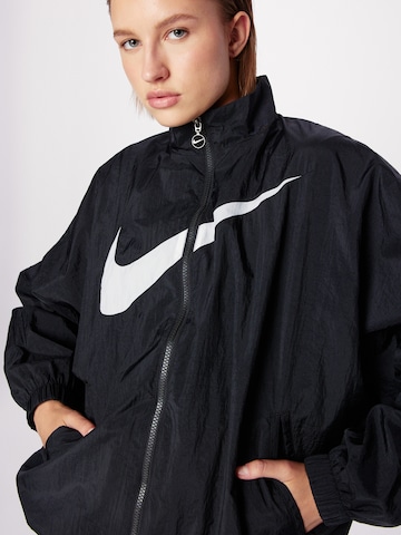 Nike Sportswear Between-season jacket 'Essential' in Black