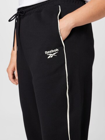 Reebok Tapered Sports trousers 'Piping' in Black