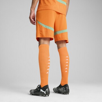 Regular Pantalon de sport PUMA en orange