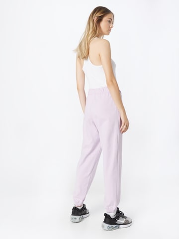 Nike Sportswear Zwężany krój Spodnie w kolorze fioletowy