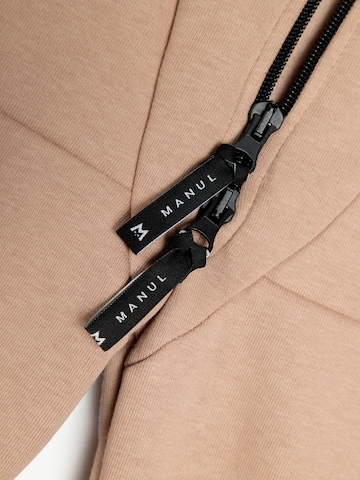 Tuta 'Biscuit by MANUL - Smart BackZip' di MANUL in beige