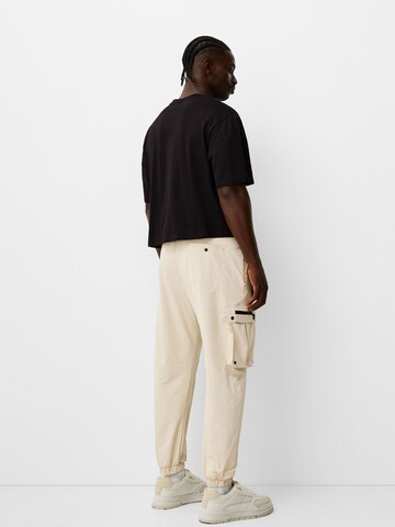 Bershka Tapered Cargo nadrágok - bézs