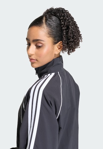 ADIDAS SPORTSWEAR - Casaco de treino 'Iconic' em preto