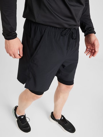 NIKE Normalny krój Spodnie sportowe 'UNLIMITED' w kolorze czarny