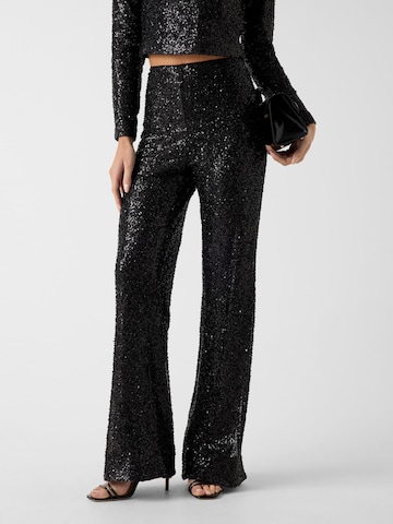 GUESS Flared Pants in Black: front