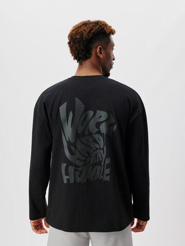 T-Shirt 'Hannes' ABOUT YOU x Kingsley Coman en noir