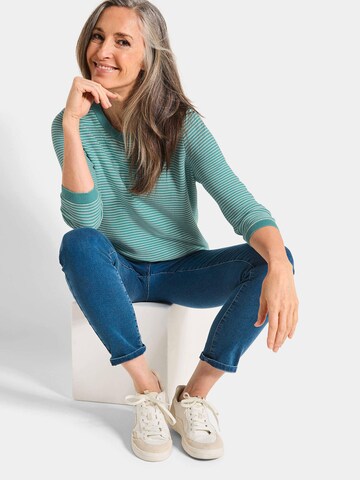 Goldner Pullover in Grün