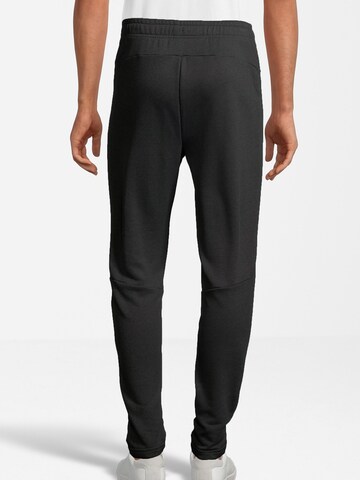 Tapered Pantaloni sport 'LANZ' de la FILA pe negru