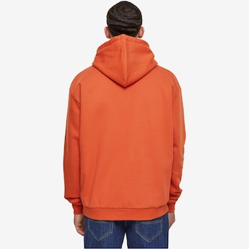 Karl Kani Sweatshirt 'KM-HD011-042-01 KK' in Orange