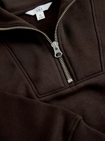 The Set Strój do biegania w kolorze brązowy