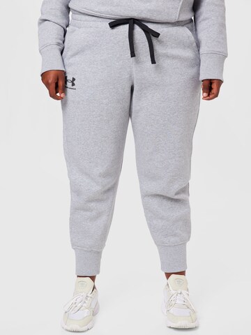 Effilé Pantalon de sport UNDER ARMOUR en gris : devant