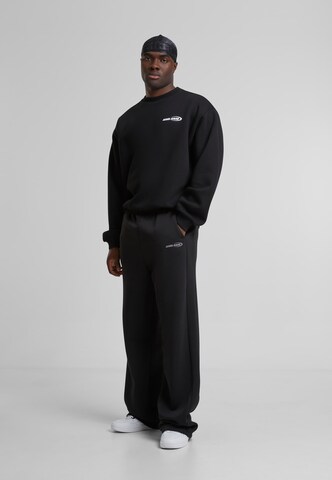 Karl Kani Sweatshirt 'Woven Signature Resist Love Crew' in Zwart