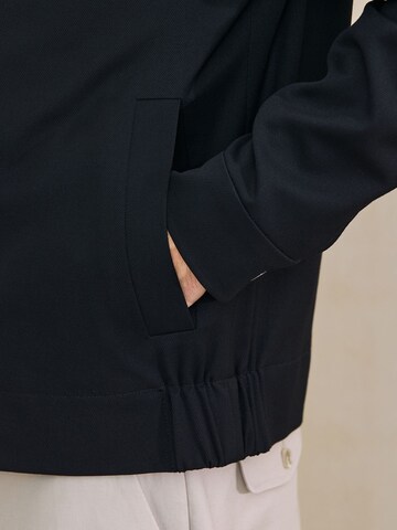 Next - Chaqueta de entretiempo 'Motionflex' en negro